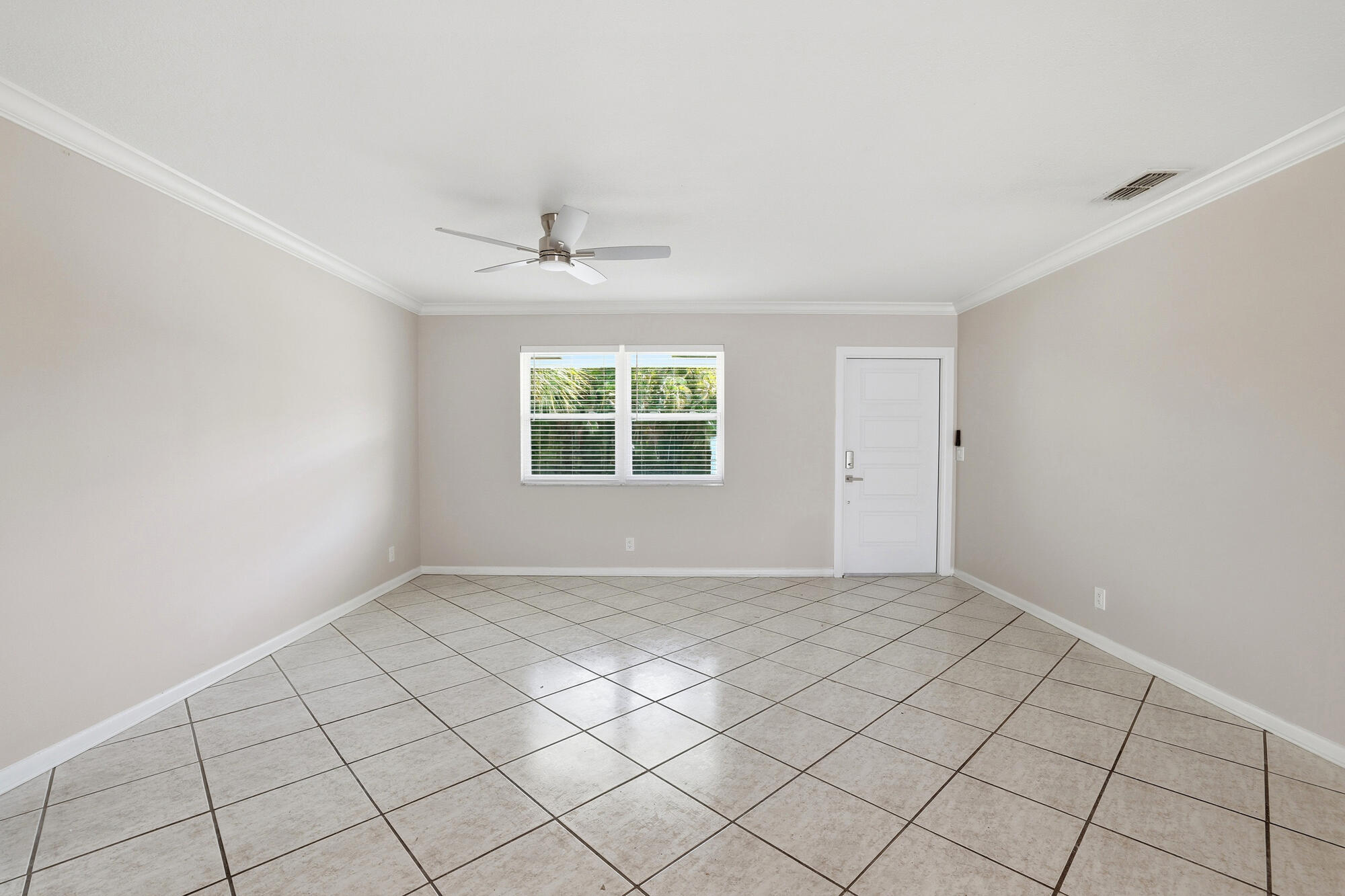 301 Wilma Circle Riviera Beach, FL 33404 - Photo 4 of 35 a view of an empty room with a window