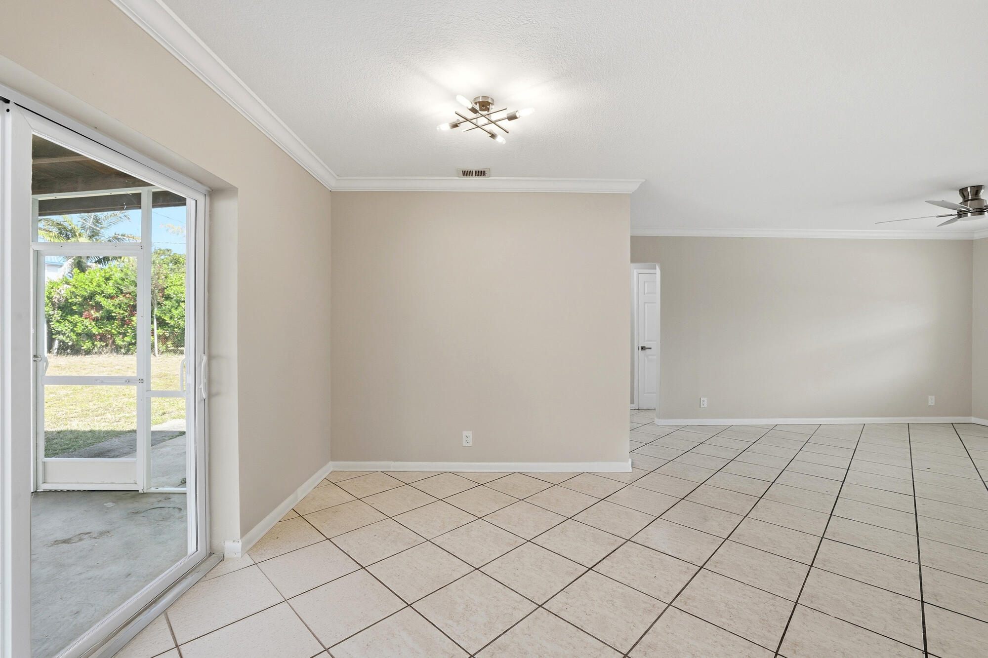 301 Wilma Circle Riviera Beach, FL 33404 - Photo 7 of 35 a view of an empty room and window