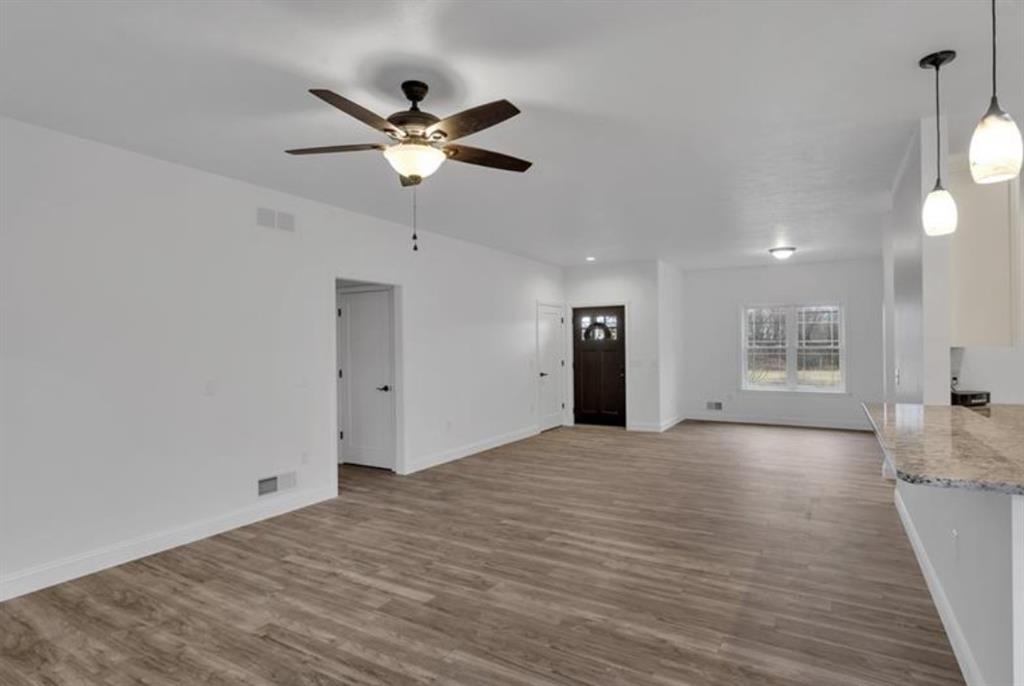 182 Murray Hill Road Tarentum, PA 15084 - Photo 14 of 35 a view of an empty room with a window and wooden floor