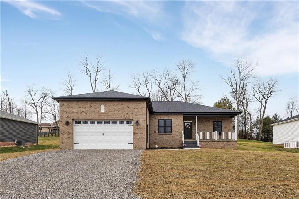 182 Murray Hill Road Tarentum, PA 15084 - Photo 2 of 35 a front view of a house with a yard and garage