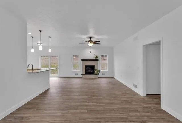 a view of a kitchen and a fireplace