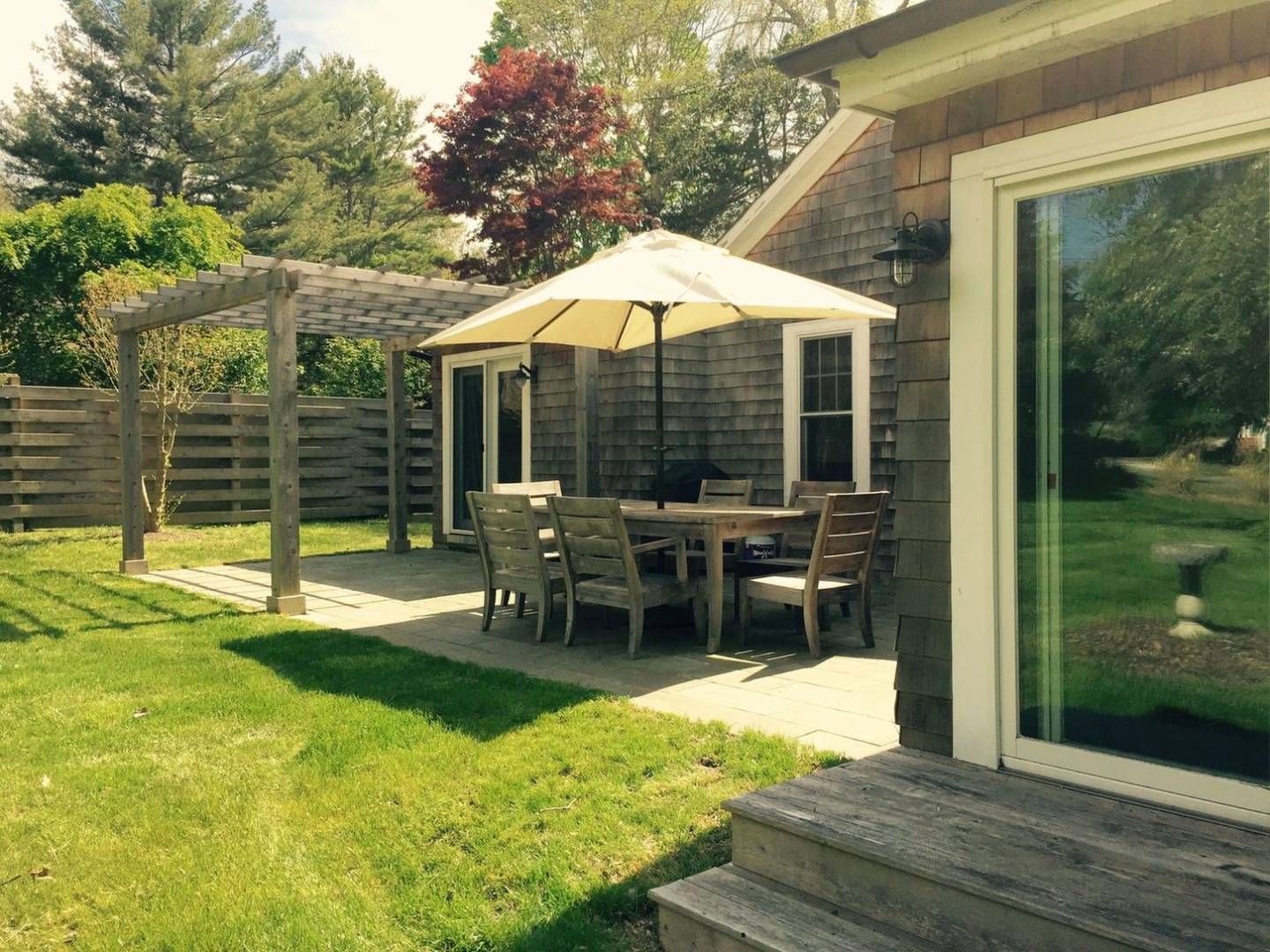 Undisclosed Address Sag Harbor, NY 11963 - Photo 13 of 14 a view of a house with backyard porch and sitting area
