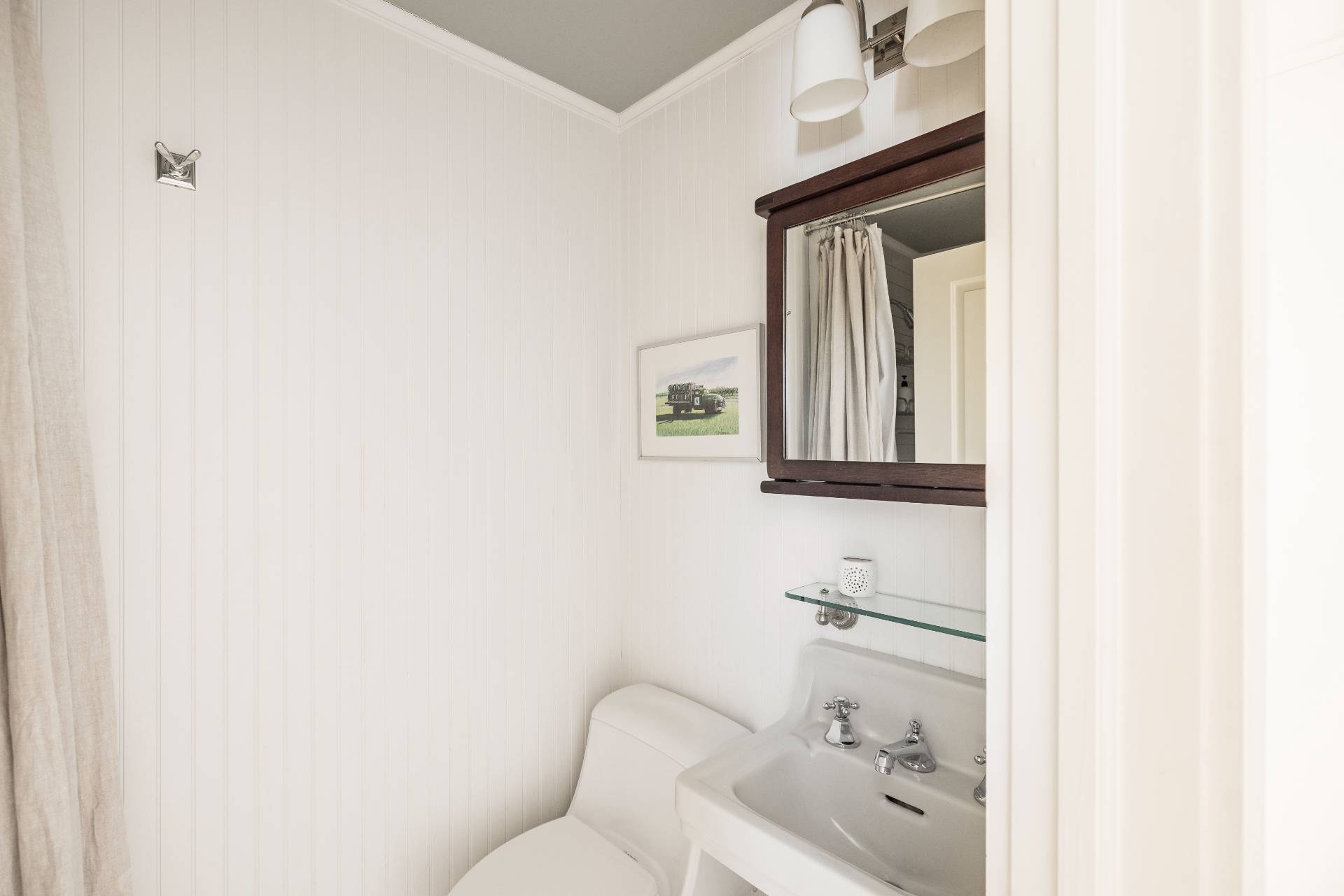 Undisclosed Address Sag Harbor, NY 11963 - Photo 10 of 14 a bathroom with a toilet sink and mirror