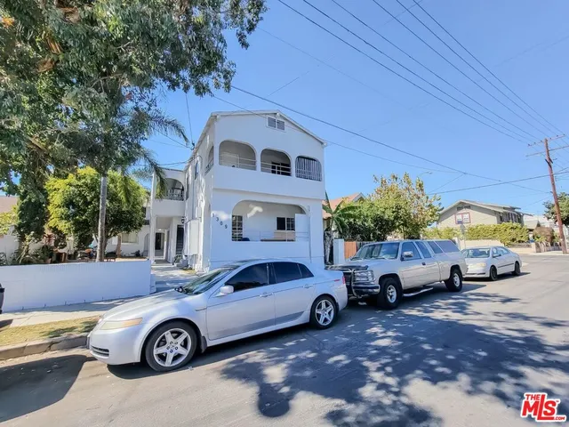 a front view of a house with parking space
