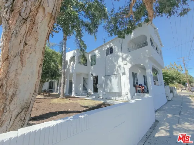 a view of a building with a tree