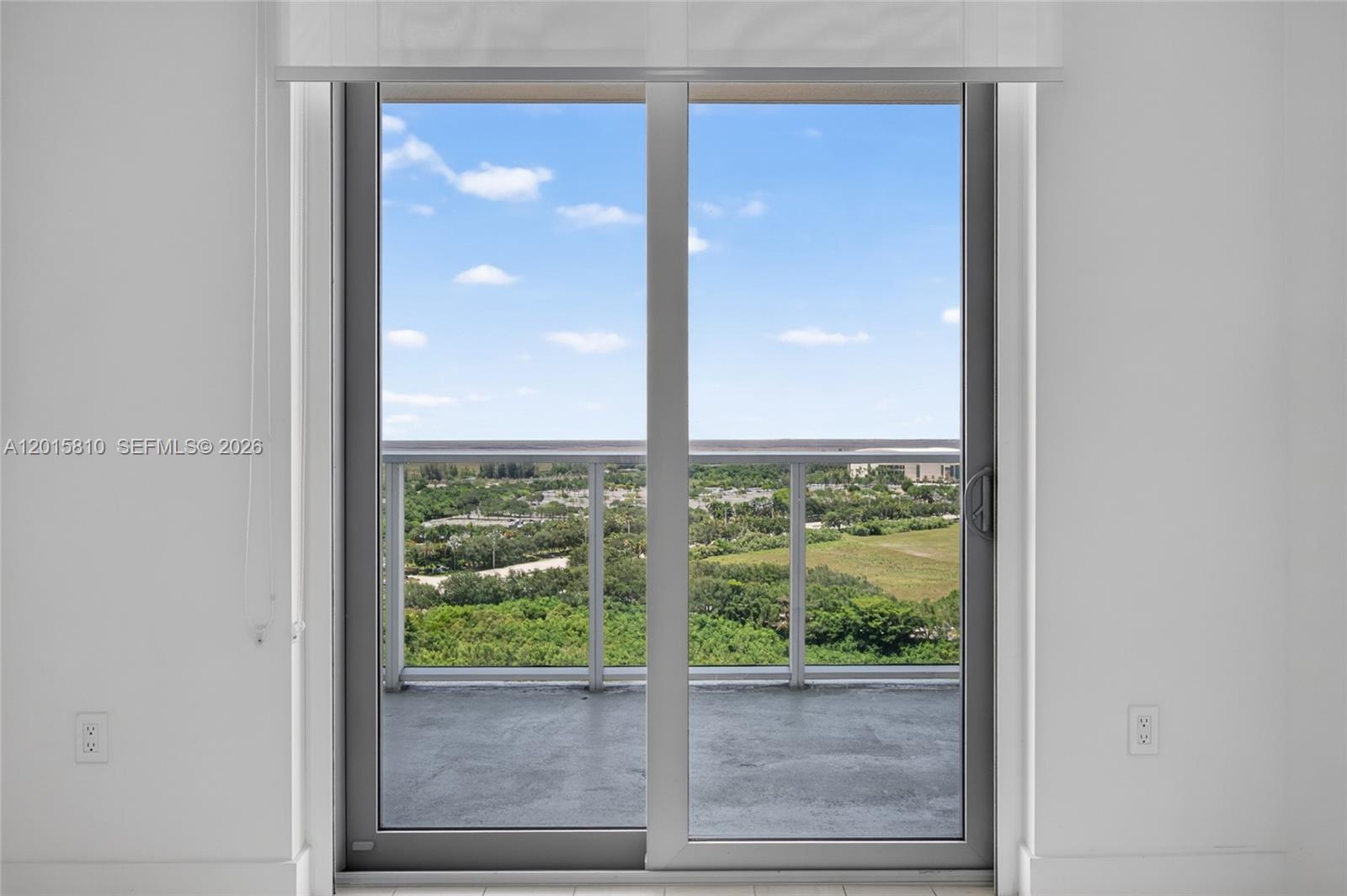 2000 Metropica Way, Unit 1902 Sunrise, FL 33323 - Photo 25 of 40 a view of a glass door with a yard from a window