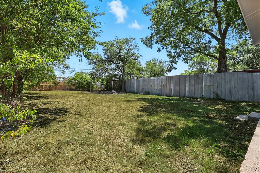 3122 Seevers Avenue Dallas, TX 75216 - Photo 14 of 16 a view of a backyard with large trees