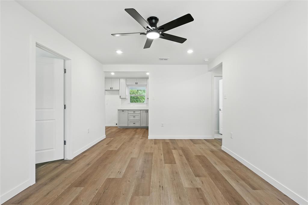 3122 Seevers Avenue Dallas, TX 75216 - Photo 4 of 16 a view of empty room with wooden floor