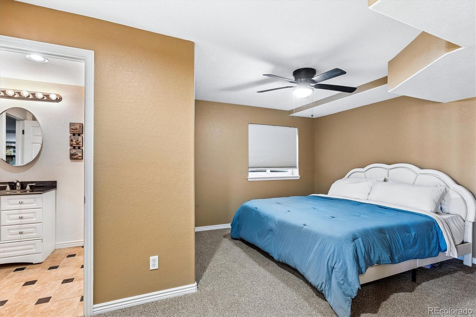 4143 South Deframe Court Morrison, CO 80465 - Photo 42 of 48 a bedroom with a bed and a window
