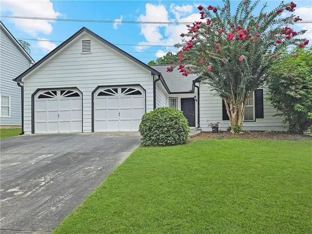 a house view with a garden space
