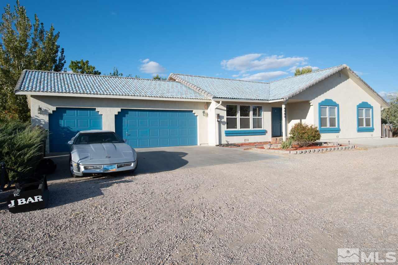 4080 Rancheria Road Fallon, NV 89406 - Photo 1 of 25 a front view of a house with a yard and garage