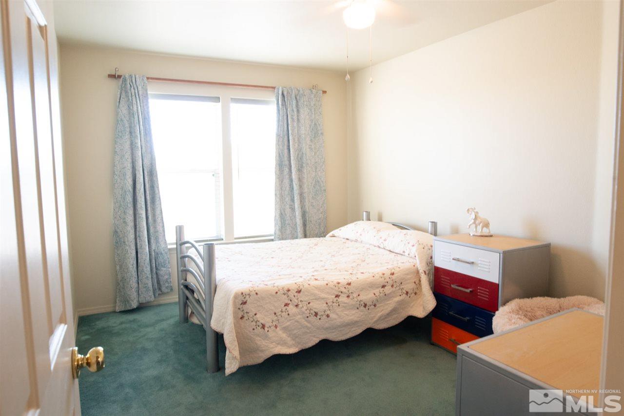 4080 Rancheria Road Fallon, NV 89406 - Photo 15 of 25 a bedroom with a bed and window