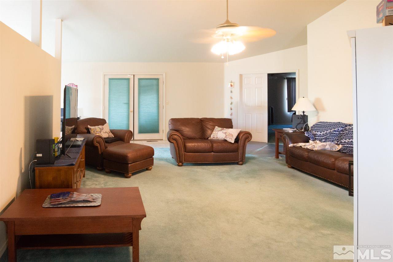 4080 Rancheria Road Fallon, NV 89406 - Photo 5 of 25 a living room with furniture and a lamp
