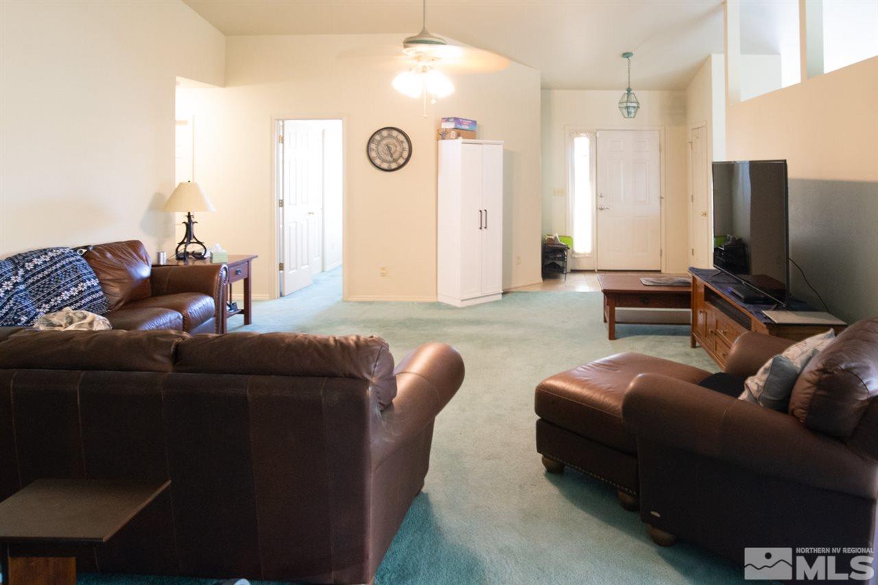 4080 Rancheria Road Fallon, NV 89406 - Photo 6 of 25 a living room with furniture and a flat screen tv