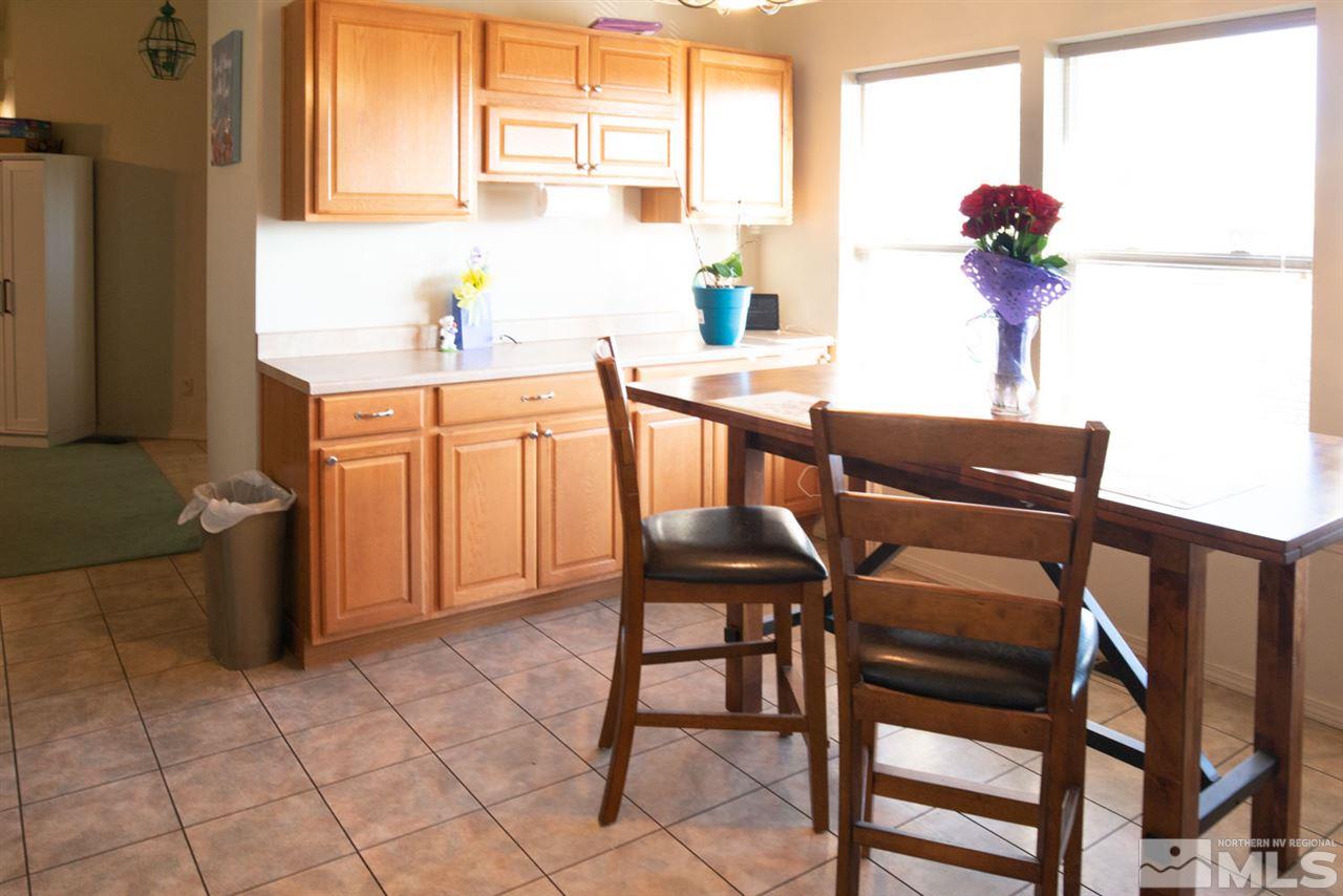 4080 Rancheria Road Fallon, NV 89406 - Photo 9 of 25 a dining room with furniture and window