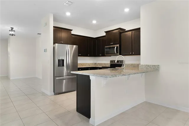 a kitchen with a sink and a window