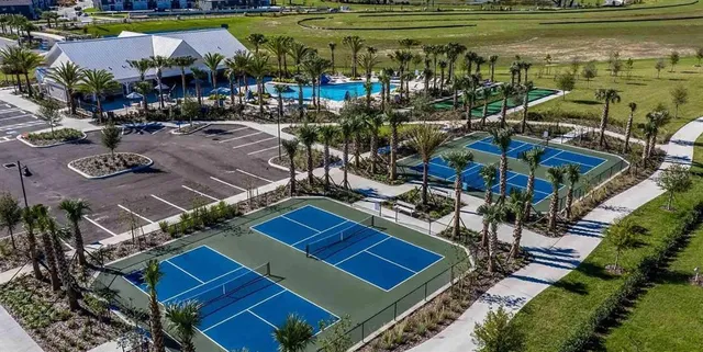 a living room with furniture fireplace and a large window