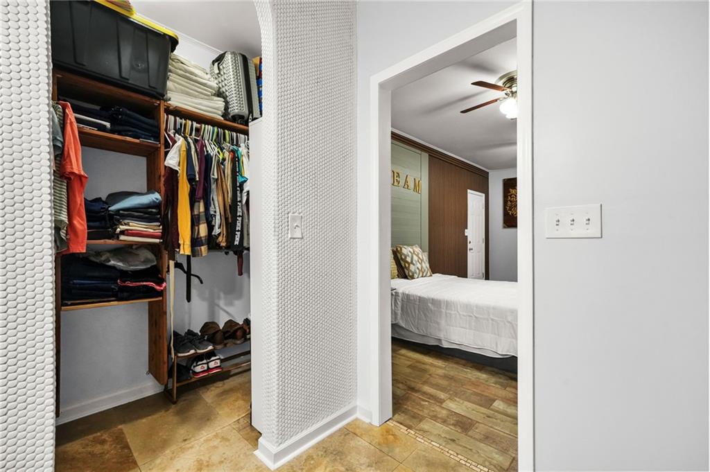2570 Spring Drive Smyrna, GA 30080 - Photo 18 of 41 a view of walk in closet with clothes and shoes