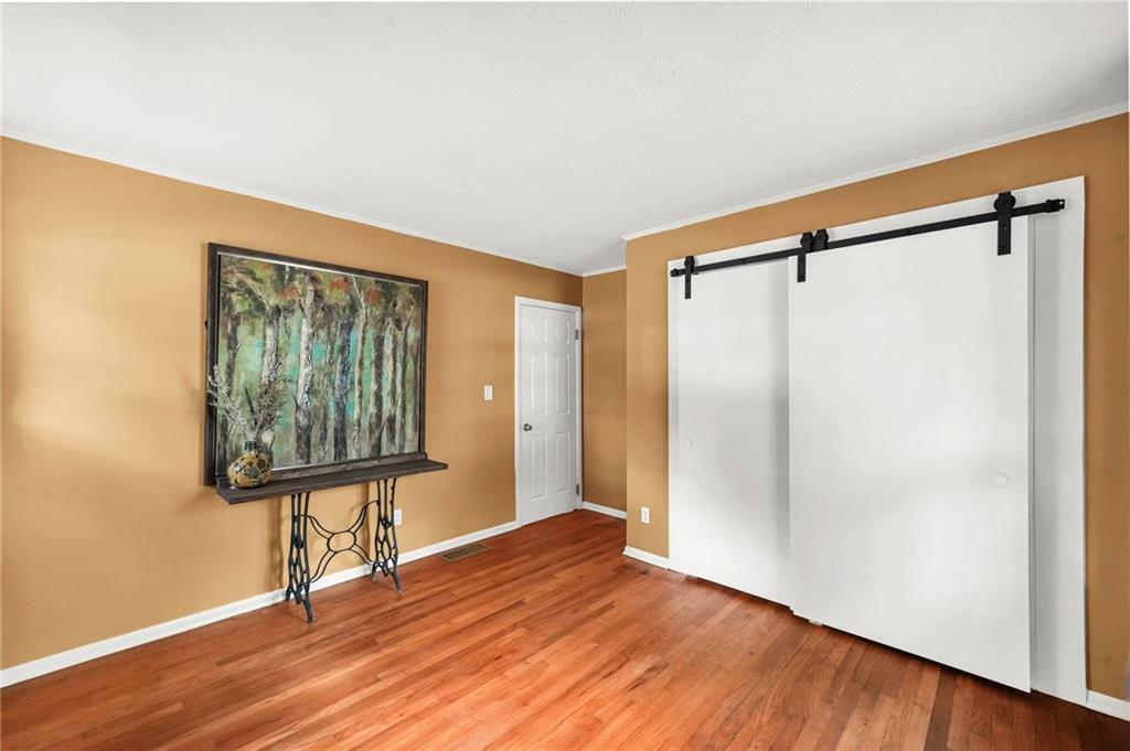2570 Spring Drive Smyrna, GA 30080 - Photo 21 of 41 a view of a room with wooden floor and windows