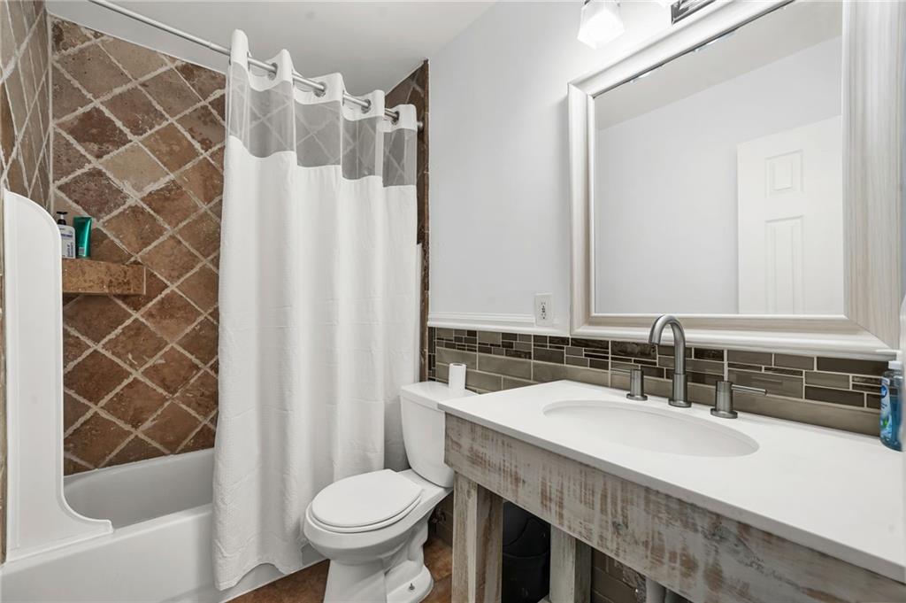 2570 Spring Drive Smyrna, GA 30080 - Photo 27 of 41 a bathroom with a sink toilet and shower