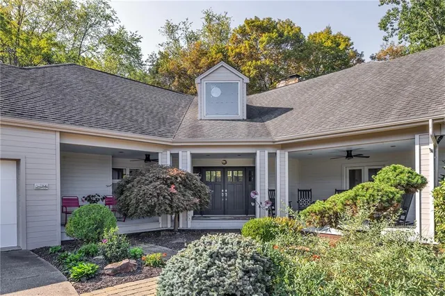 front view of a house with potted plants