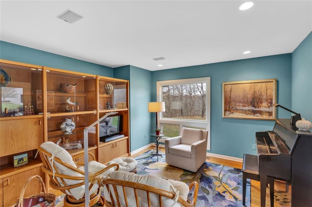 369 Maple Lane Canonsburg, PA 15317 - Photo 27 of 50 a living room with furniture a flat screen tv and a floor to ceiling window