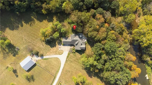 an aerial view of residential house with outdoor space and lake view