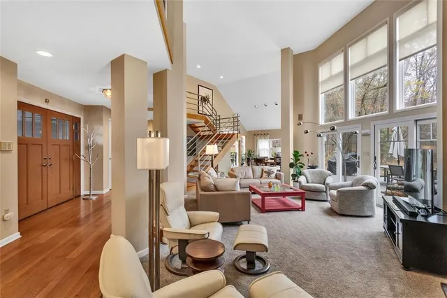 a living room with furniture or couch and a large window