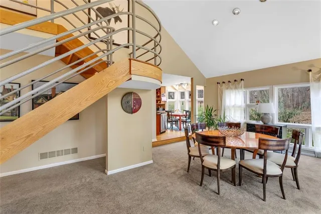 a dining room with furniture and window