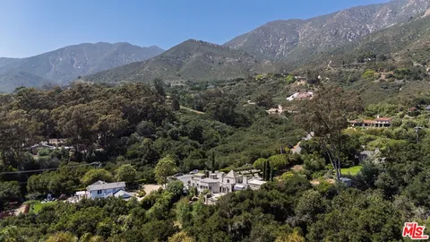 an aerial view of residential house and green space