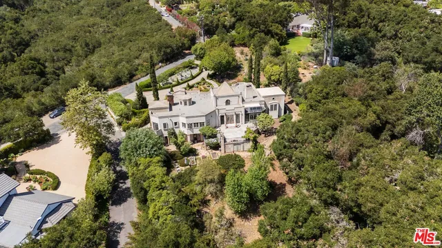 an aerial view of residential house with outdoor space