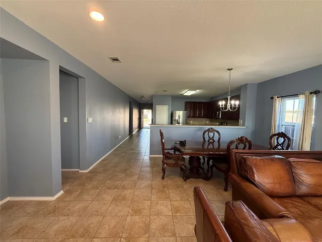 a kitchen with stainless steel appliances kitchen island granite countertop a sink and cabinets