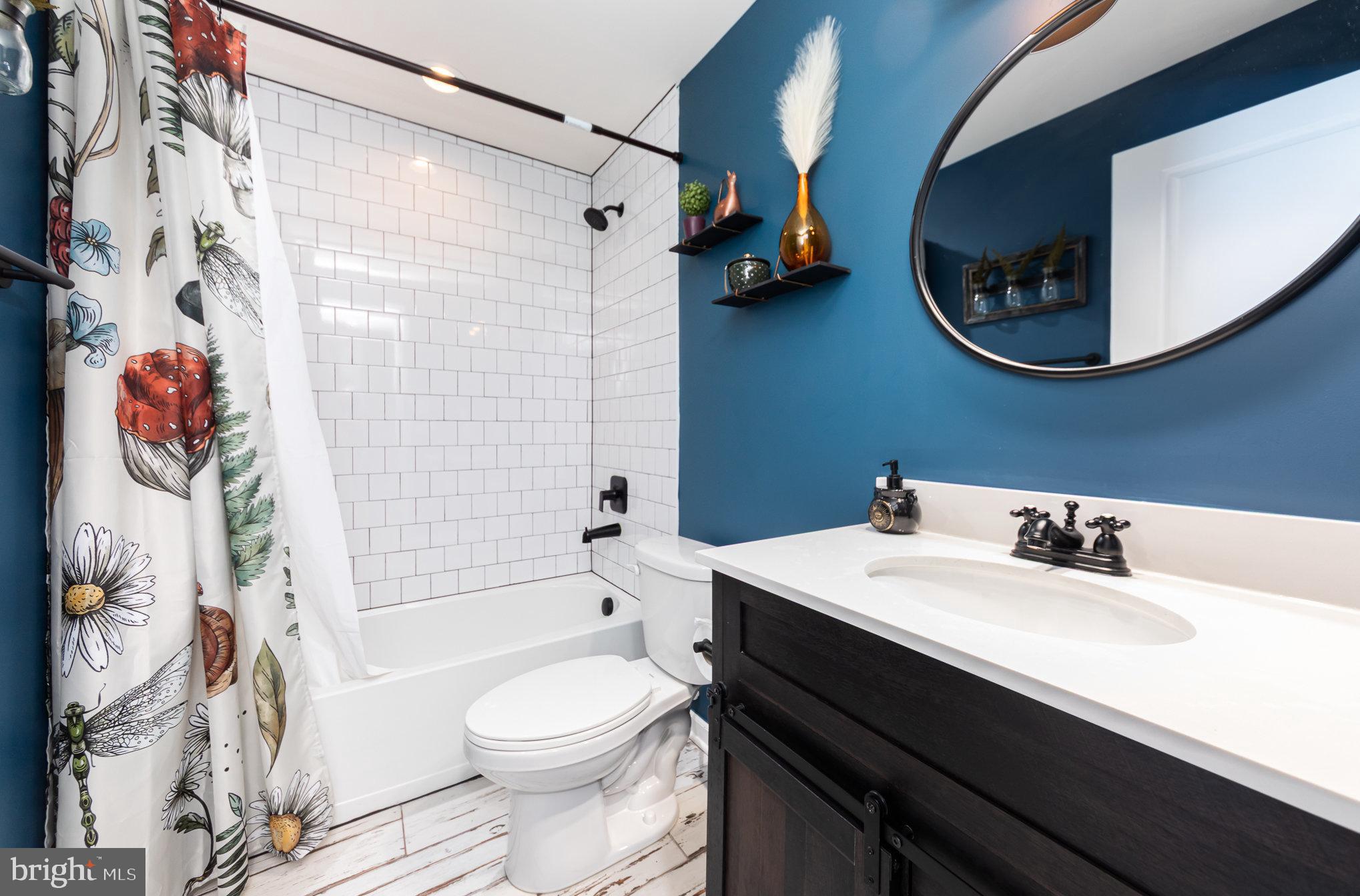7464 Cedar Fork Road Ruther Glen, VA 22546 - Photo 13 of 24 a bathroom with a sink a toilet and shower