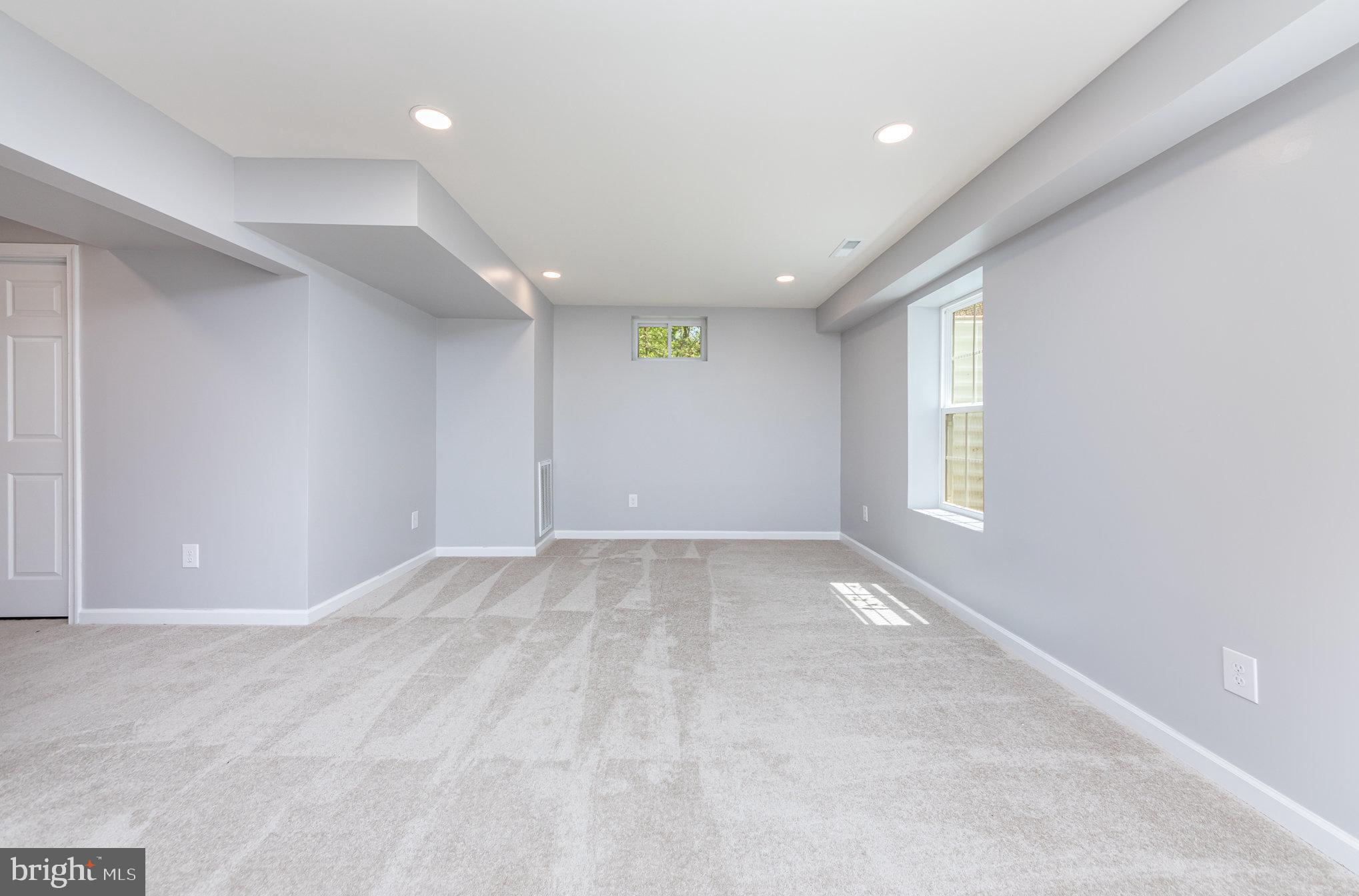 7464 Cedar Fork Road Ruther Glen, VA 22546 - Photo 14 of 24 en empty room with windows