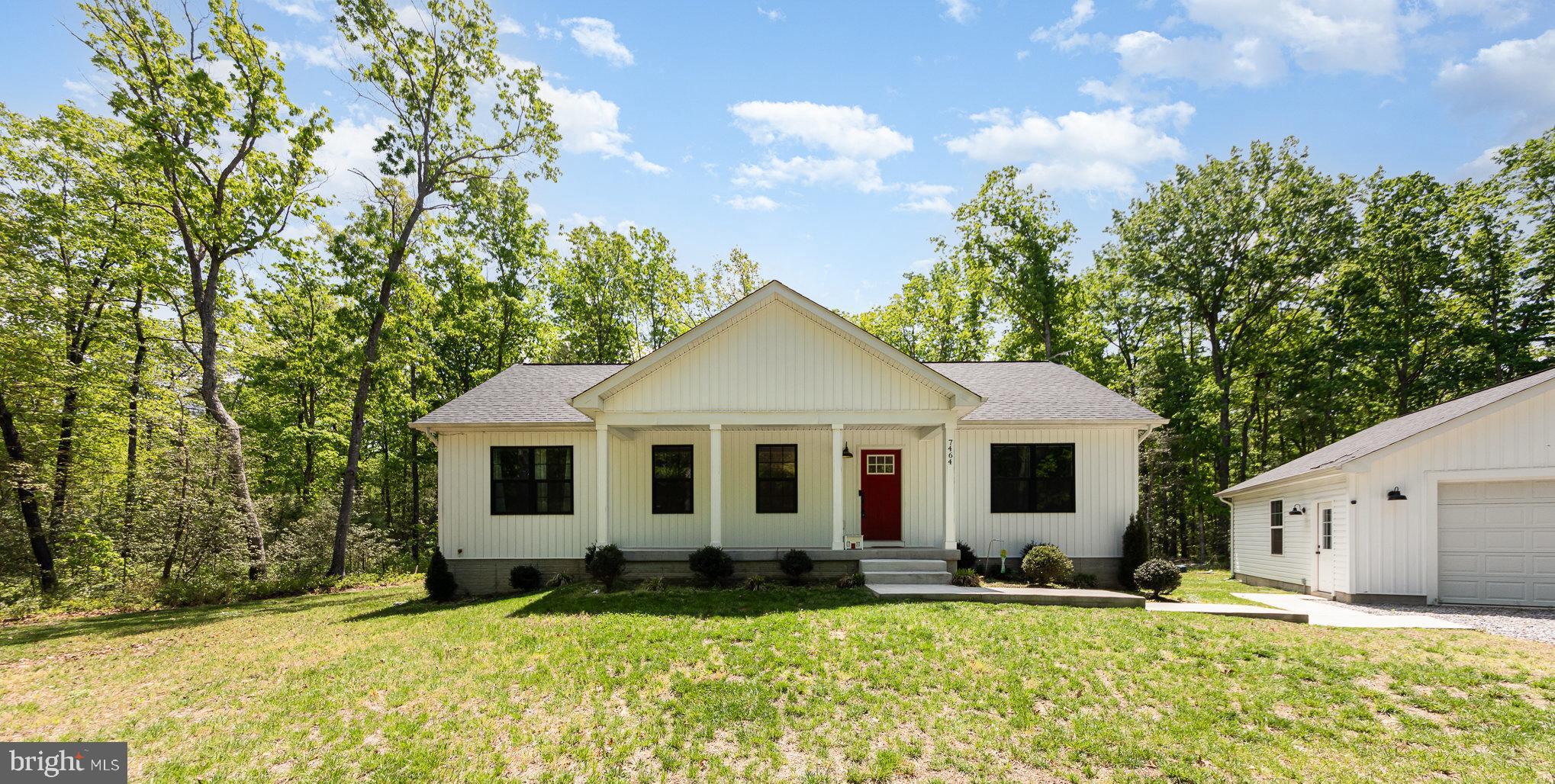 7464 Cedar Fork Road Ruther Glen, VA 22546 - Photo 2 of 24 a view of a house with a yard
