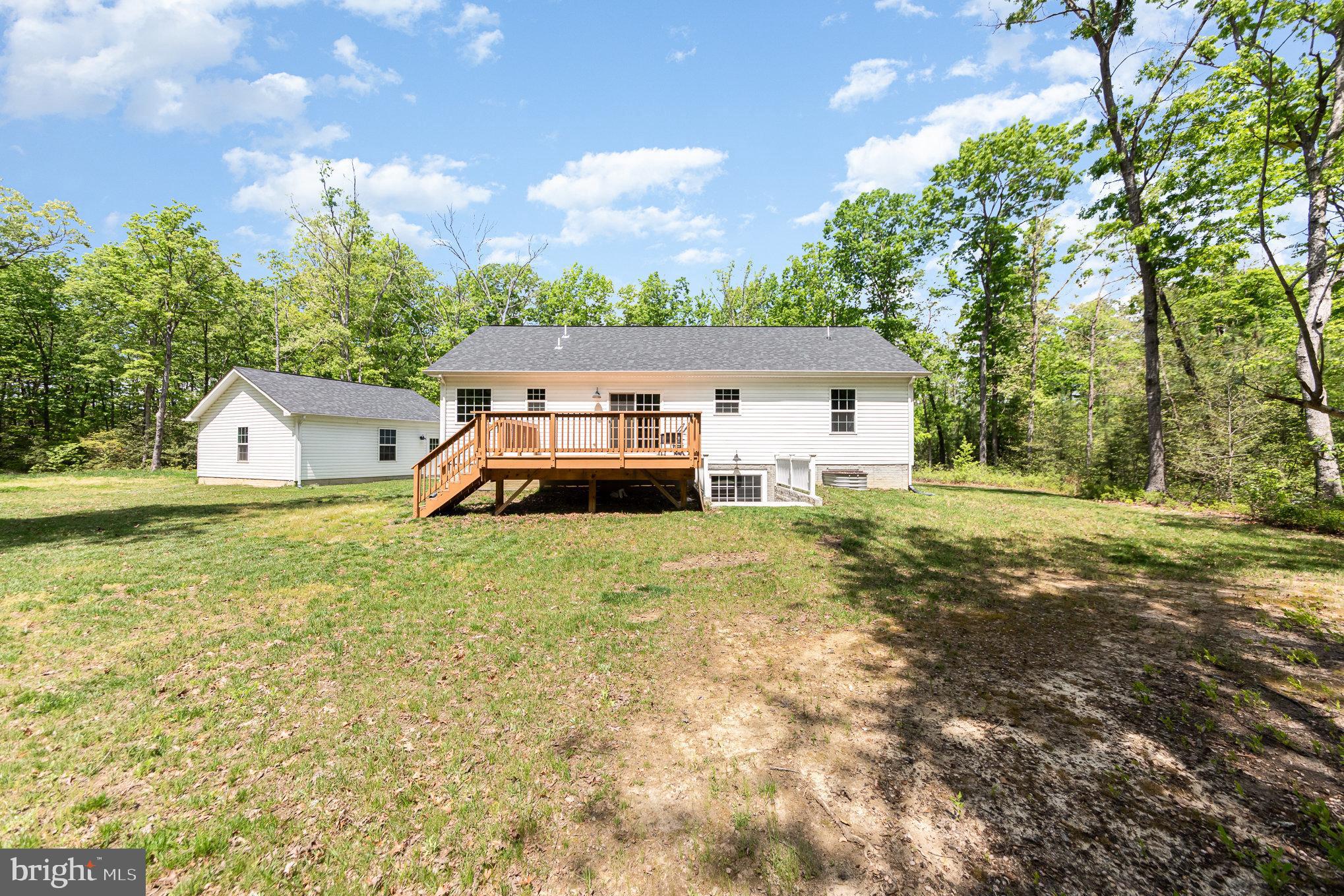 7464 Cedar Fork Road Ruther Glen, VA 22546 - Photo 22 of 24 a house view with a garden space