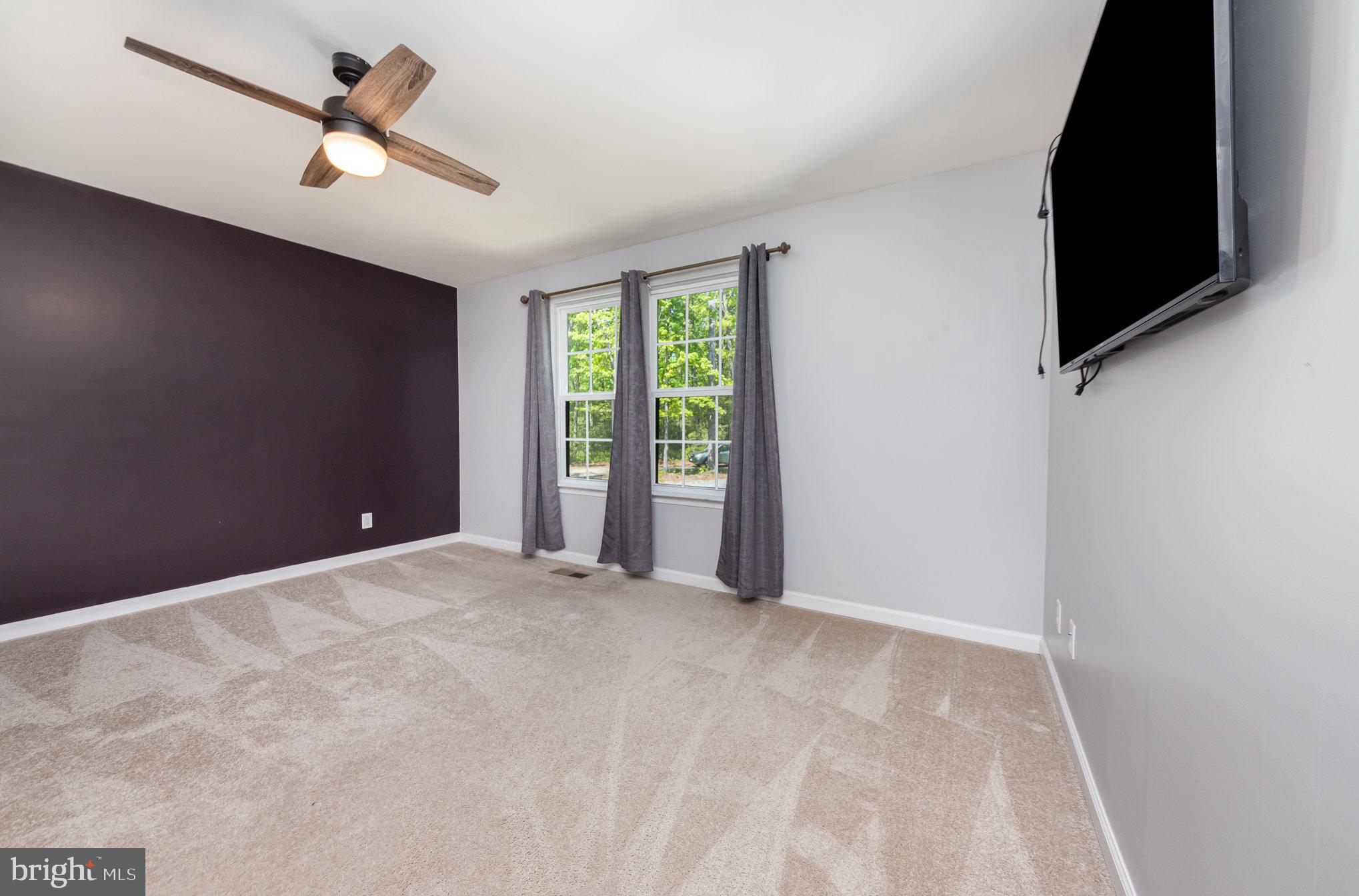 7464 Cedar Fork Road Ruther Glen, VA 22546 - Photo 7 of 24 a view of an empty room with a window