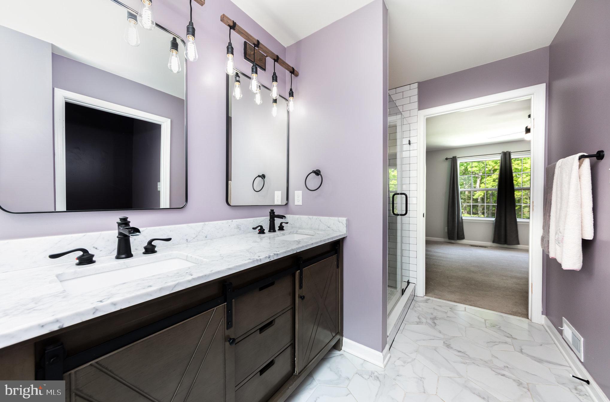 7464 Cedar Fork Road Ruther Glen, VA 22546 - Photo 10 of 24 a en suite bathroom with a granite countertop sink and a mirror
