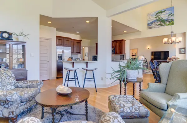 a living room with furniture a rug and a fireplace