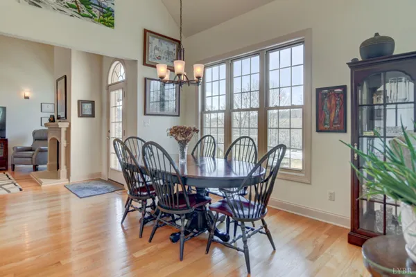 a living room with furniture fireplace and a window