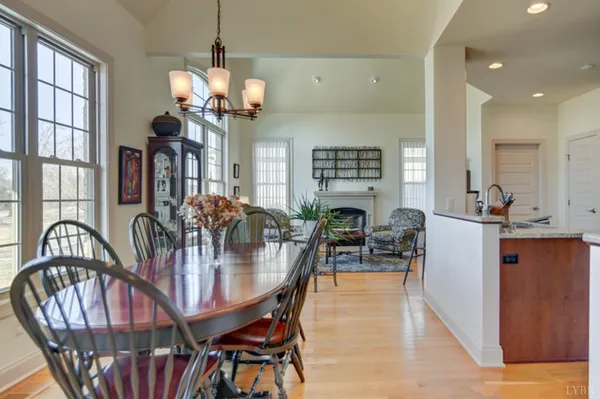 a view of living room with furniture and a chandelier