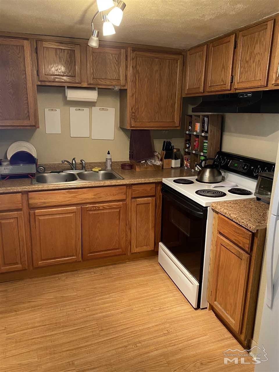 3670 Gypsum Road Reno, NV 89503 - Photo 17 of 29 a kitchen with a sink stove and cabinets