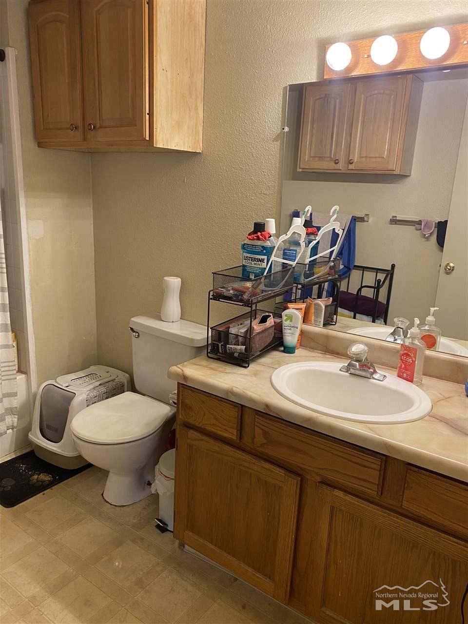 3670 Gypsum Road Reno, NV 89503 - Photo 19 of 29 a bathroom with a toilet sink and mirror