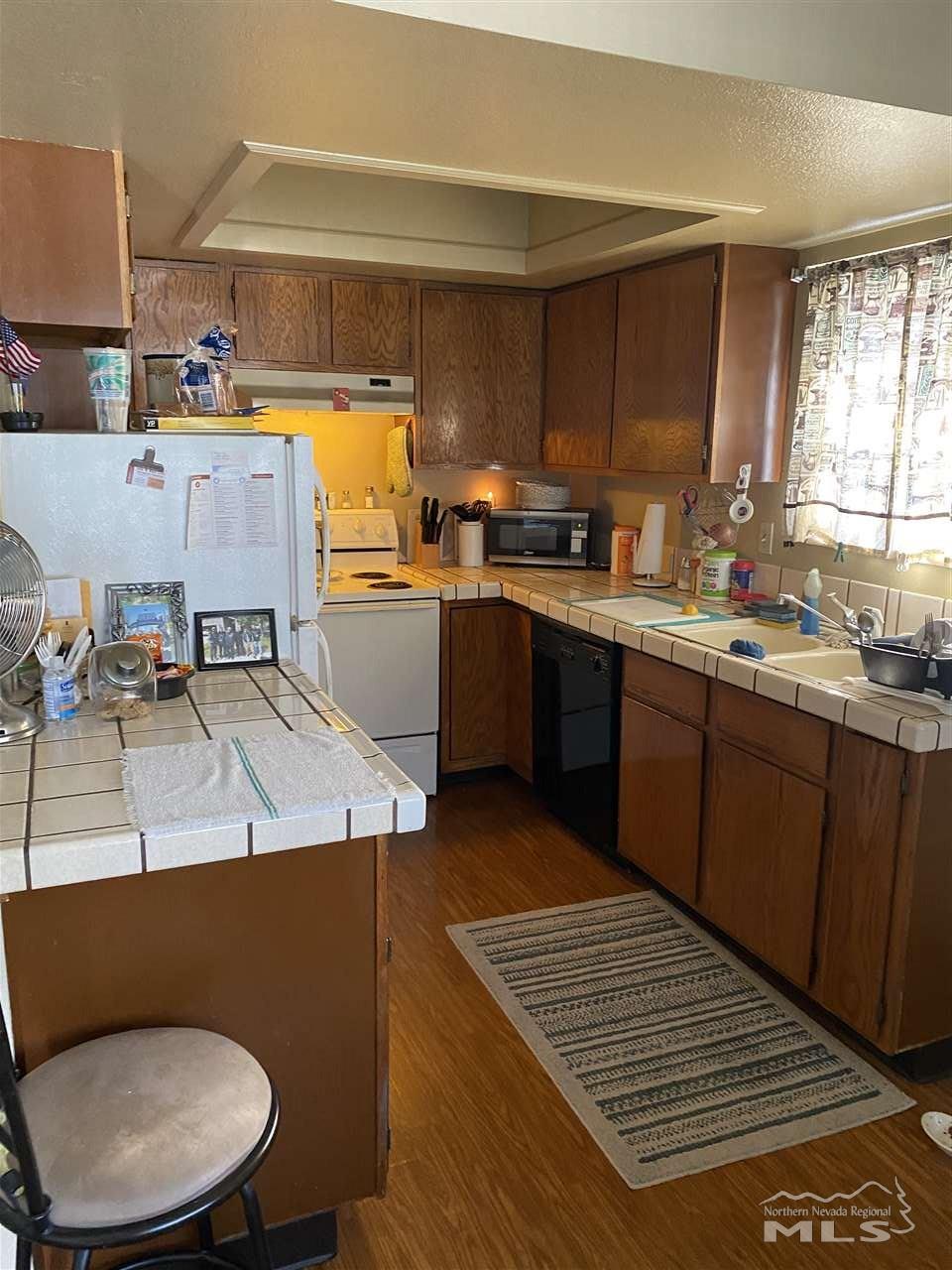 3670 Gypsum Road Reno, NV 89503 - Photo 21 of 29 a kitchen with a sink cabinets and window