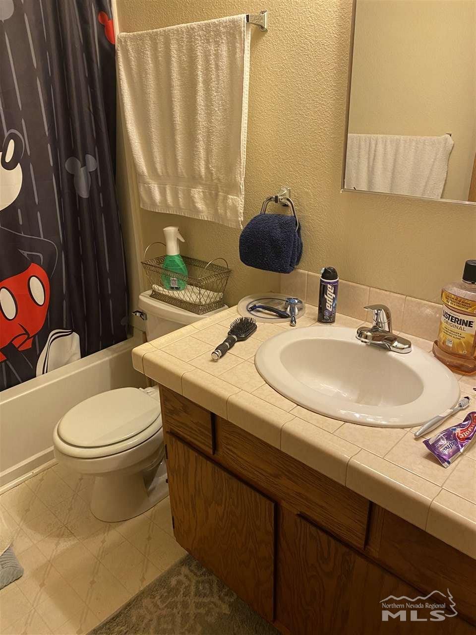 3670 Gypsum Road Reno, NV 89503 - Photo 24 of 29 a bathroom with a sink toilet and mirror