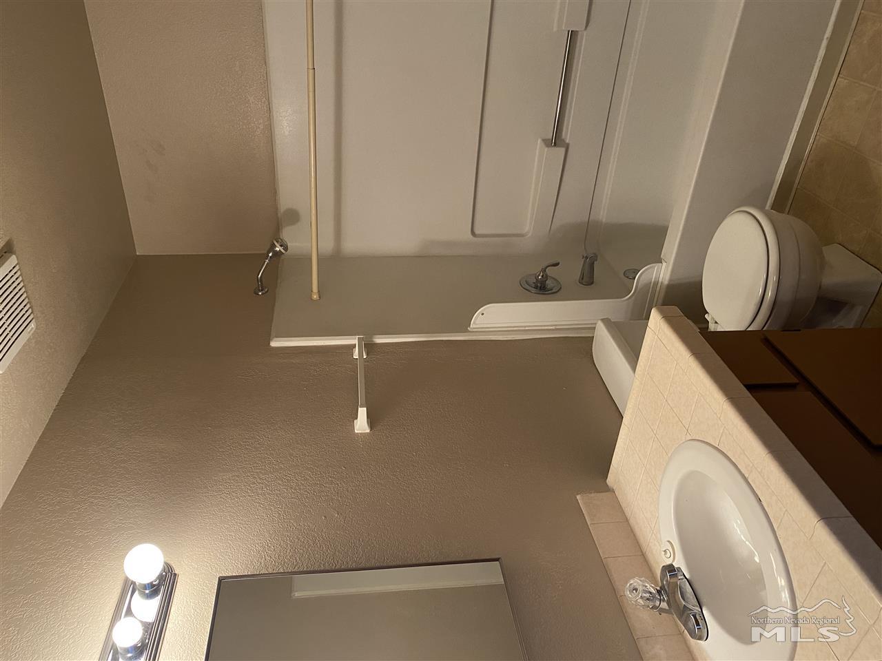 3670 Gypsum Road Reno, NV 89503 - Photo 10 of 29 a bathroom with a sink toilet and shower