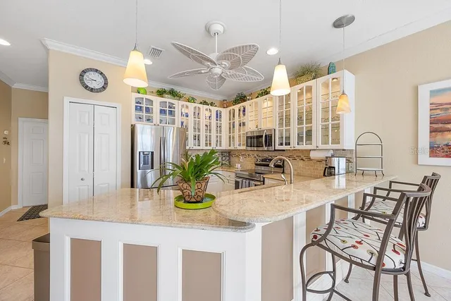 a kitchen with a table and chairs in it