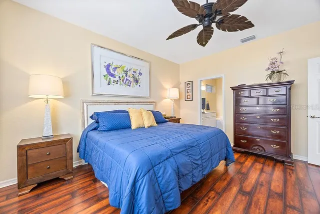 a bedroom with a bed and a dresser