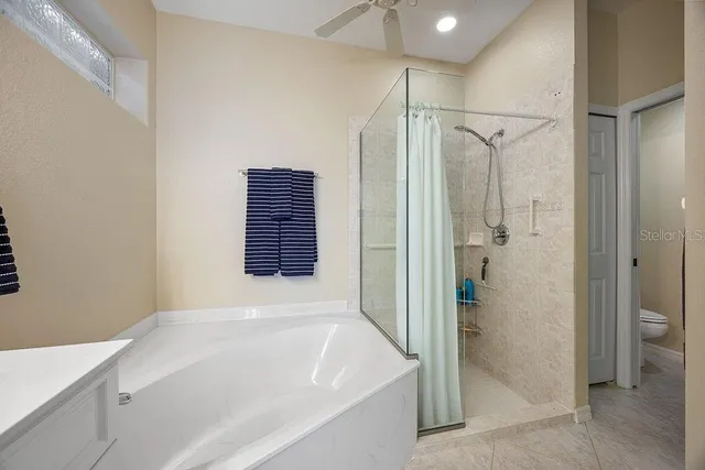 a bathroom with a bathtub and a shower