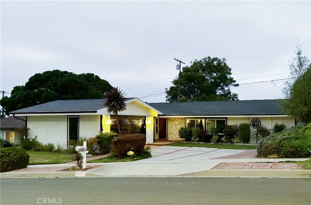 a house view with a garden space
